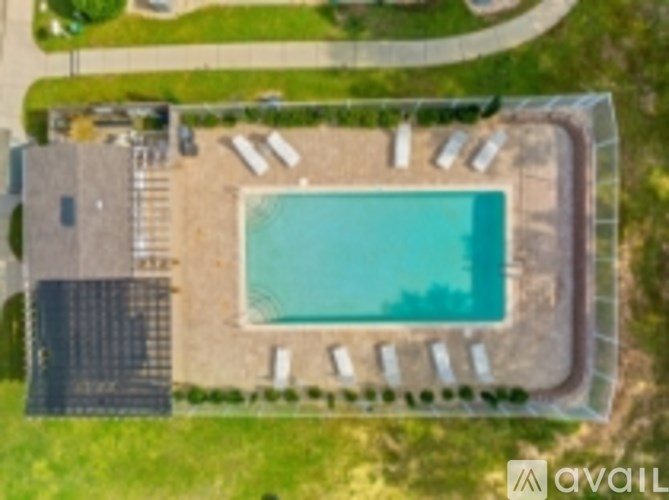 An aerial view of a house with a swimming pool.