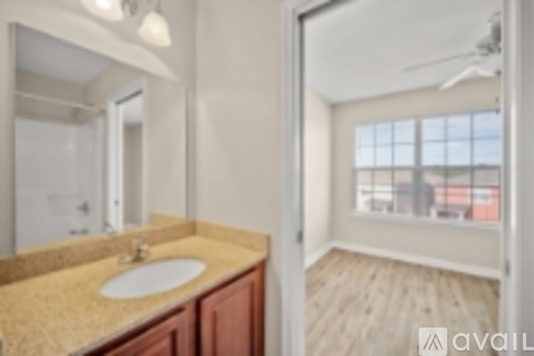 A bathroom with a sink and mirror.