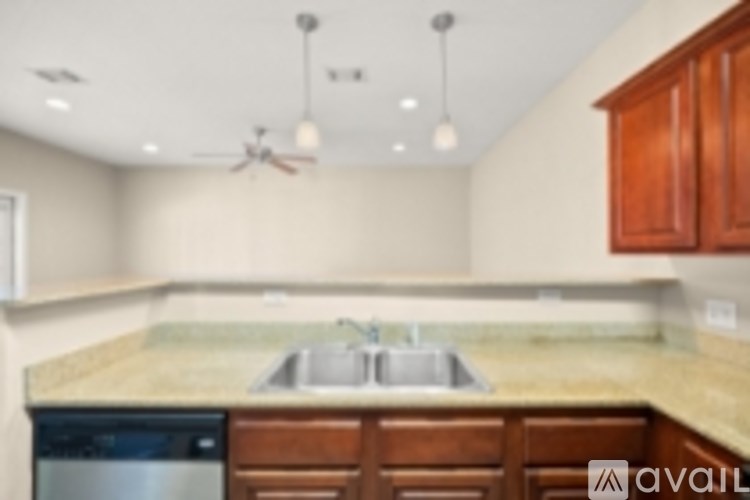 A kitchen with a sink and a dishwasher.