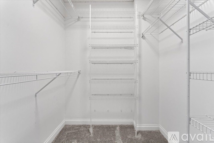 Empty white shelving unit in a room.