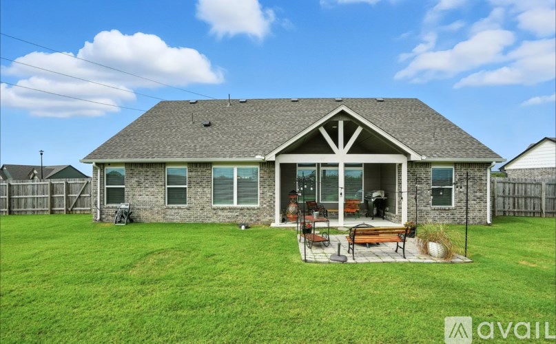 A house with a lawn in front of it.