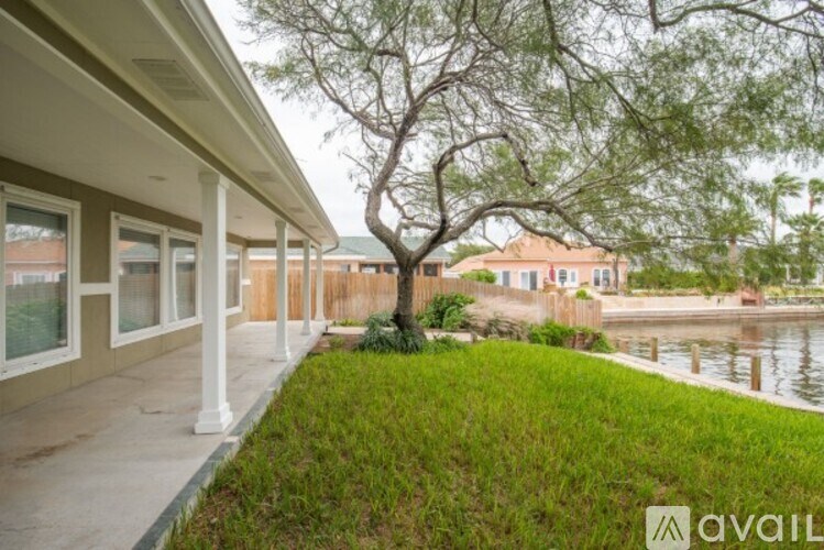A house with a tree in front of it.