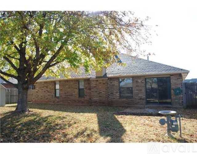 A house with a tree in front of it.