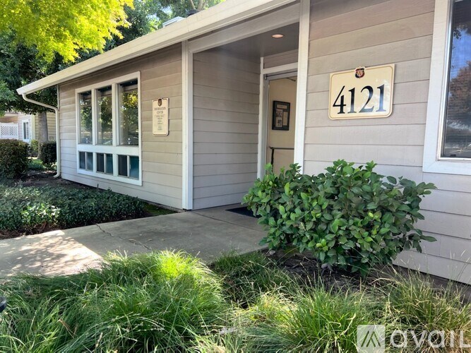 A small house with the number 4121 on the front.