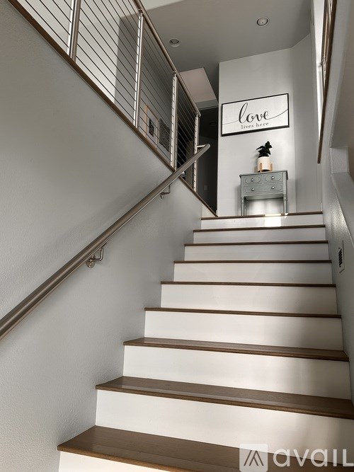 A staircase with a sign that says "love" on it.