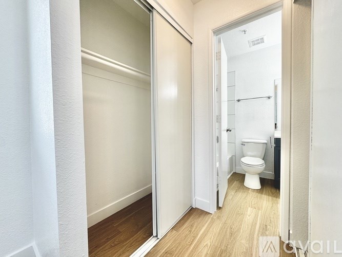 A bathroom with a toilet and a walk-in shower.