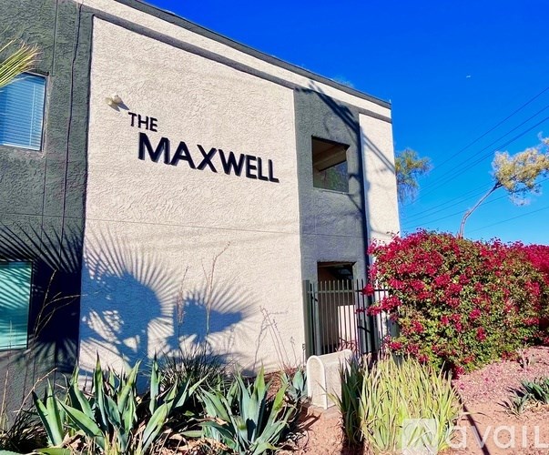 The Maxwell building has a sign on the side.