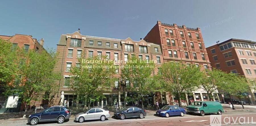 A street view of a building with the text "Boston on the town" on it.