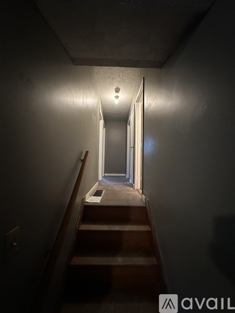 A stairway with a light at the top.