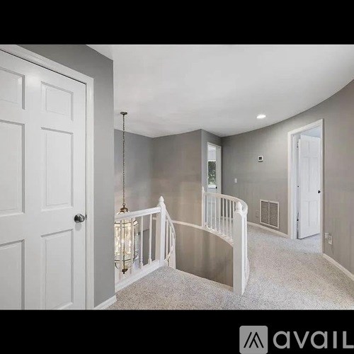 A white door is on the left side of the image.