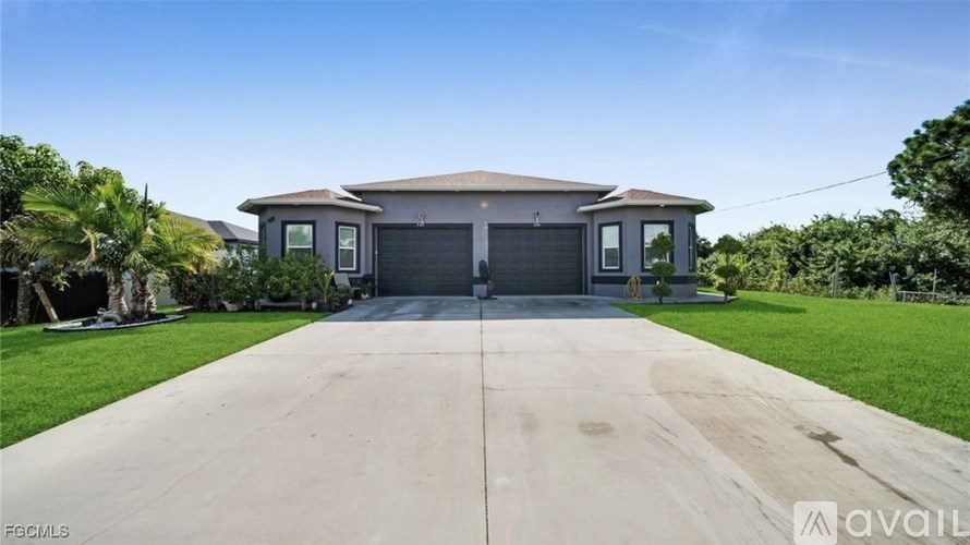 A house with a driveway in front of it is for sale.