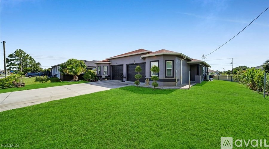 A house with a large front yard is for sale.