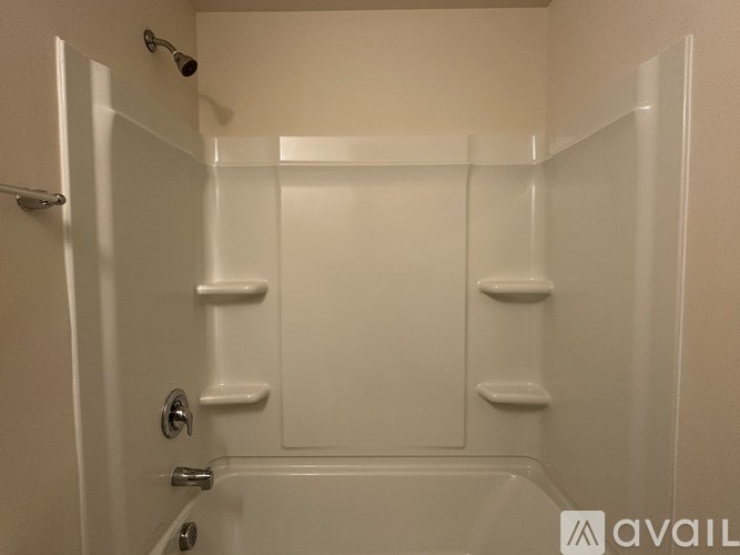 A white bathroom with a glass shower door and a glass shower door.