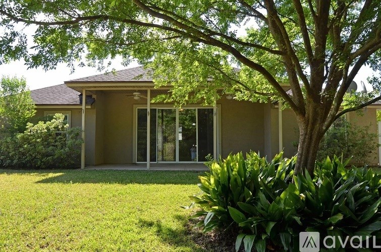 A house with a tree in front of it.