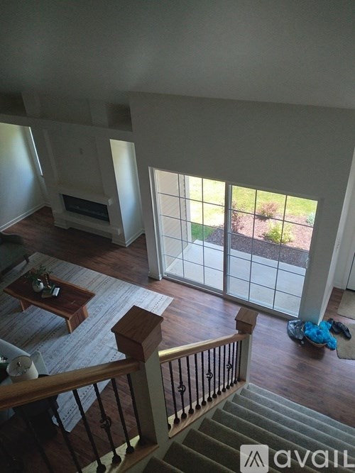 A living room with a staircase leading to the upper floor.