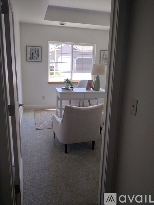 A room with a table and chairs in it.