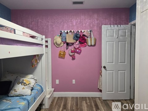 A room with bunk beds and a door.