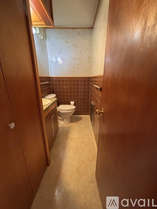 A bathroom with a toilet and sink.