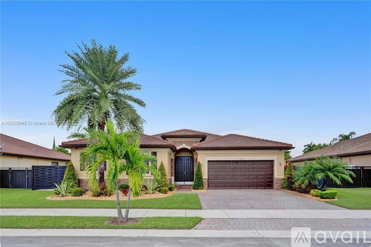 A house with a palm tree in front of it.