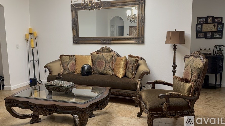A living room with a sofa, chair, and coffee table.