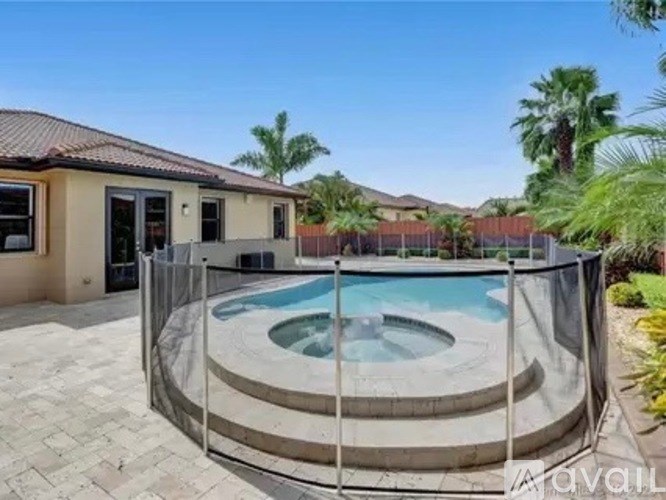 A house with a pool in the backyard.