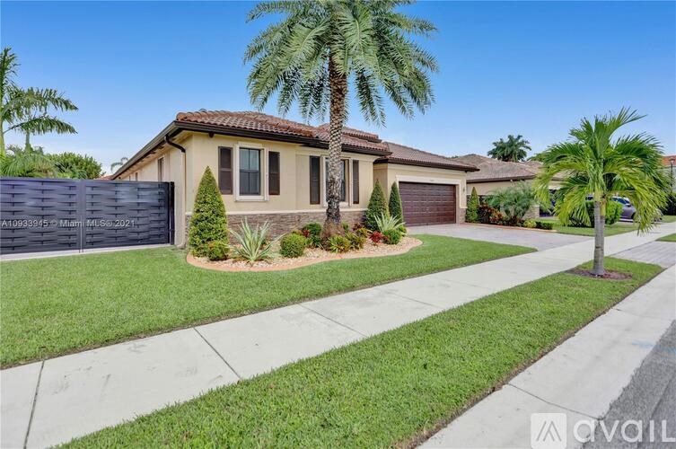 A house with a palm tree in front of it.