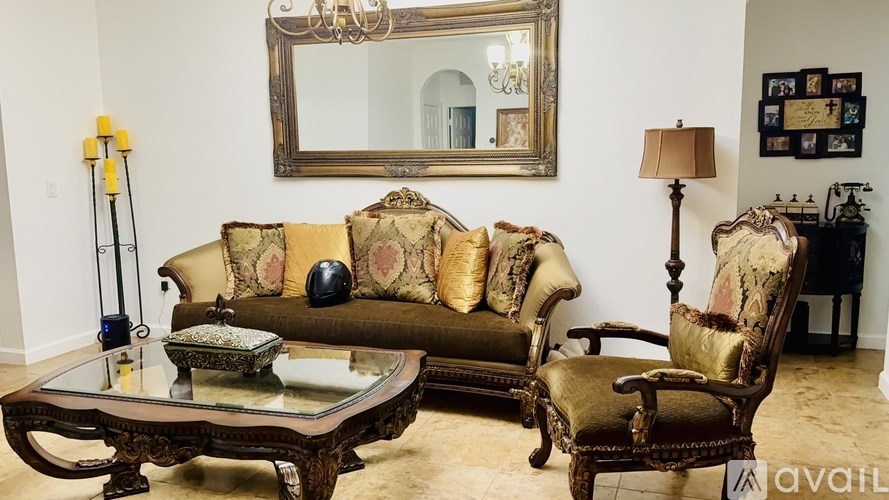 A living room with a sofa, chair, and coffee table.