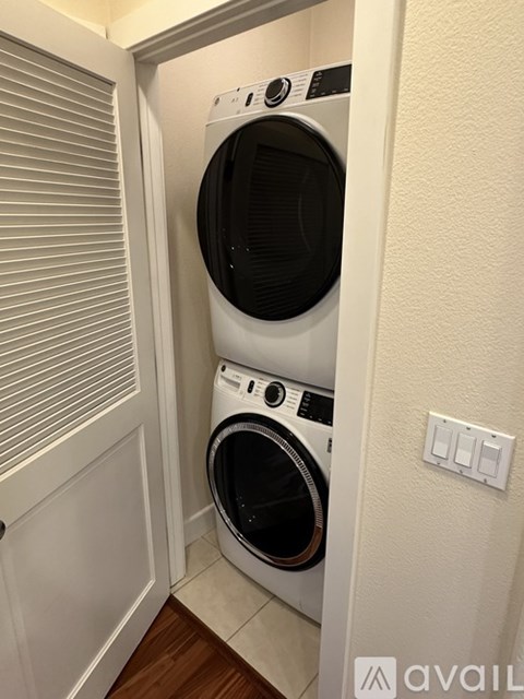 A kitchen with wooden cabinets and a white refrigerator.