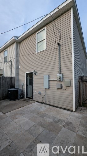 A house with a garage and a driveway.
