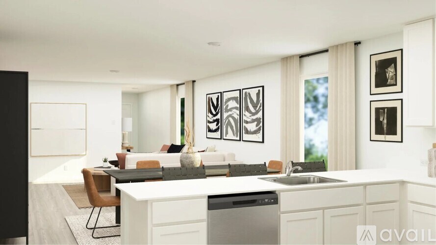 A modern kitchen with a dining table and chairs.