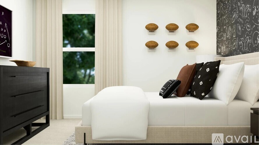 A modern bedroom with a large bed and a chalkboard on the wall.