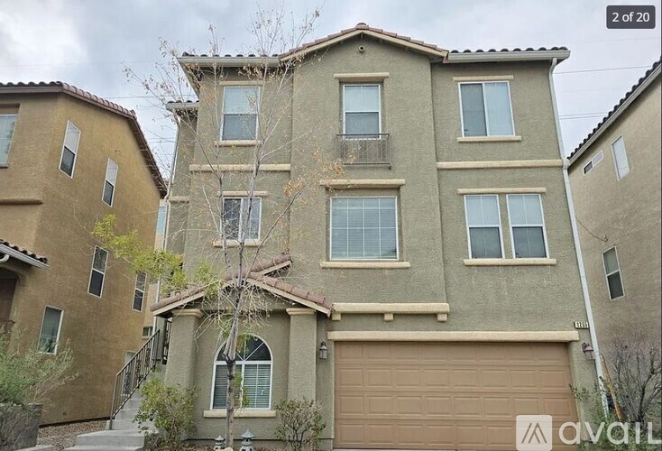 A two story house with a balcony on the second floor.