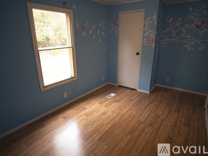 A room with blue walls and a white door.