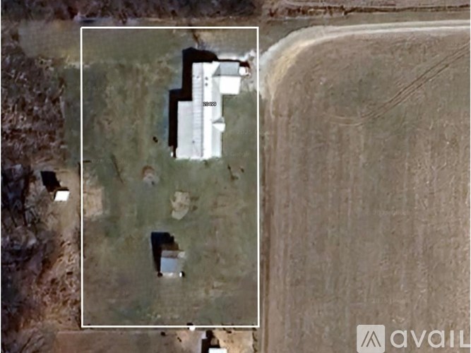 A satellite image shows a large building with the label "SEWAGE" on it, surrounded by a field and a few smaller structures.