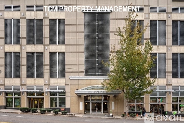 A large building with the words "TCM PROPERTY MANAGEMENT" on the side.