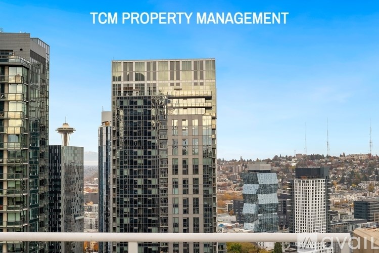 A cityscape with the text "TCM PROPERTY MANAGEMENT" overlaid on the top.