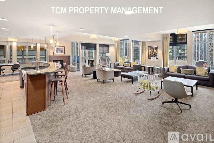 A modern office space with the text "TCM PROPERTY MANAGEMENT" and "available" on the wall.