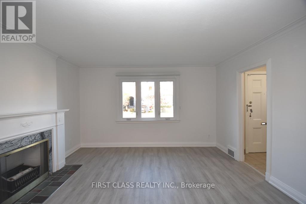 A room with a fireplace and a door is shown.