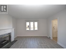 A room with a fireplace and a door is shown.
