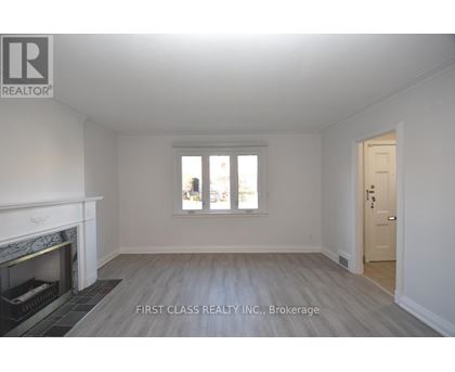 A room with a fireplace and a door is shown.