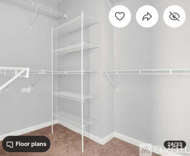 Empty white shelving unit in a room.