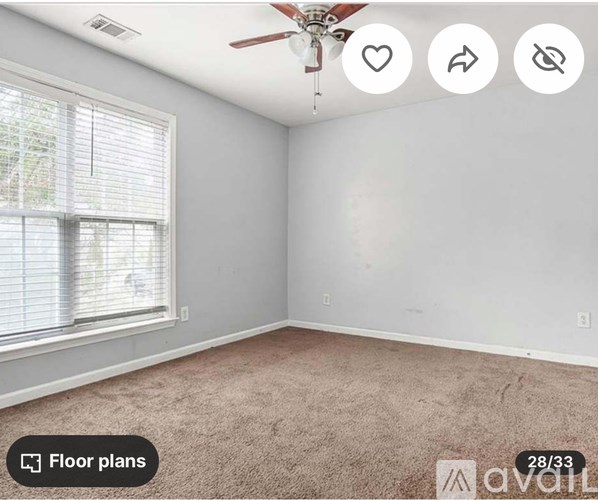 A room with a carpet floor, a window with blinds, and a ceiling fan.