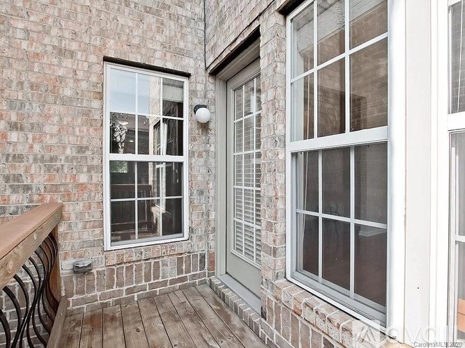 A brick building with a window and a door.