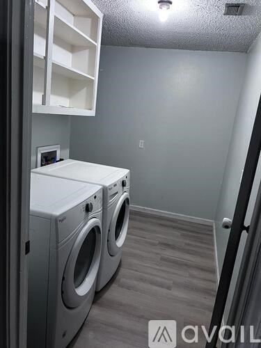 A laundry room with a washer and dryer.