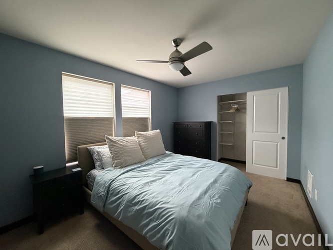 A gym with a weight machine and a yellow curtain.