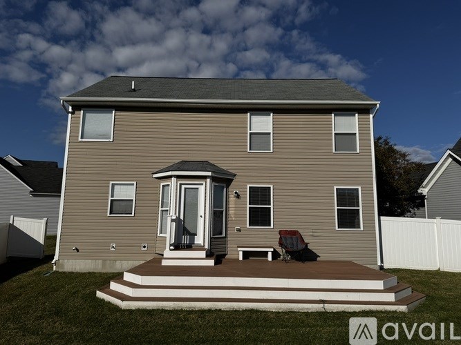 A house with a porch and a covered patio.