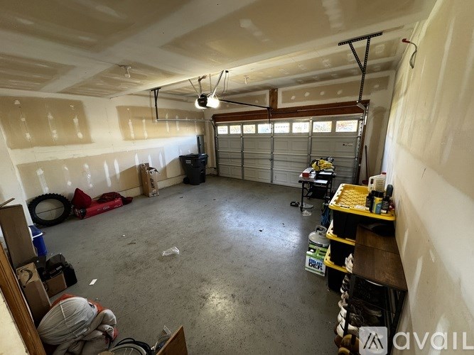 A garage with a lot of tools and equipment.