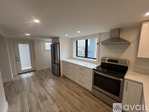 A kitchen with a stove, oven, and refrigerator.