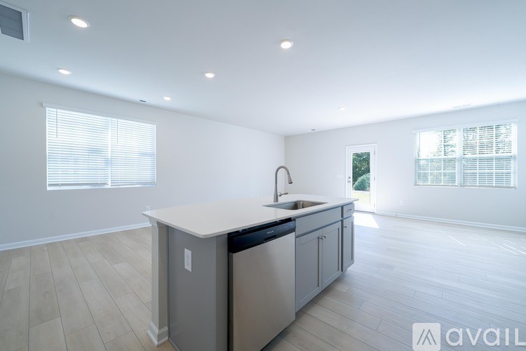 A kitchen with a sink and a window.