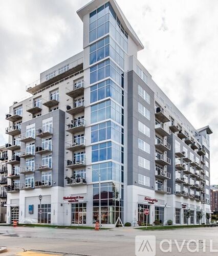A large multi-story building with many windows and balconies.
